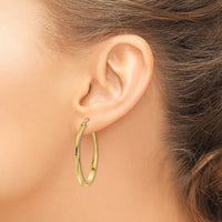 14K Polished Twisted Oval Hoop Earrings-TF2144