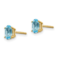 14k 6x4 Oval December/Blue Topaz Post Earrings-XBE24